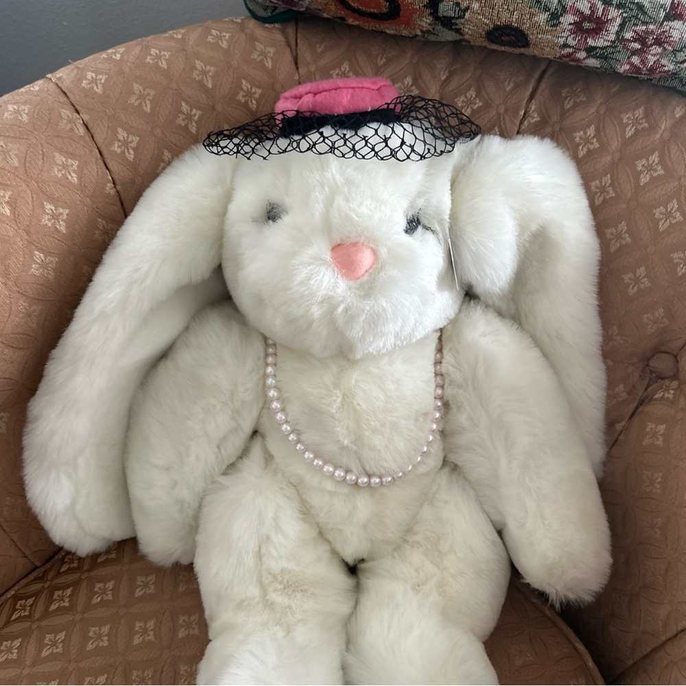 Charming Pink and White Stuffed Animal with Elegant Accessories